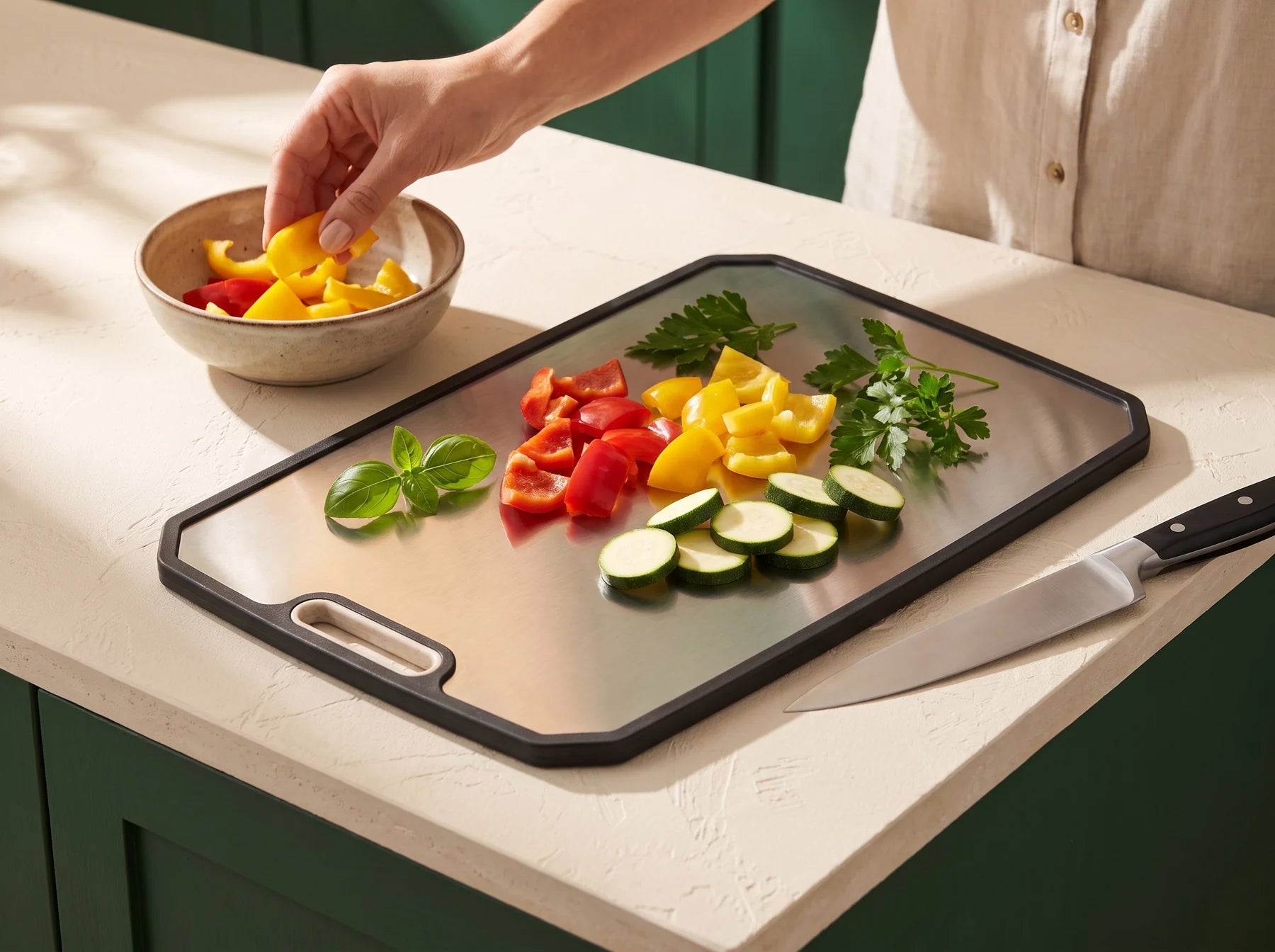 Fresh vegetables being prepared on the titanium face of the double-sided board