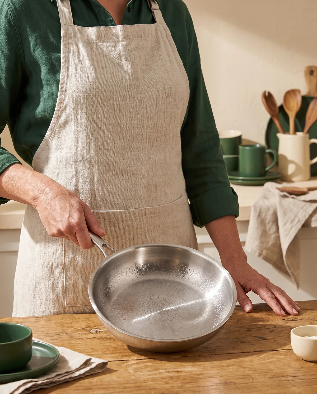 Titan Titanium Pan held by a home cook