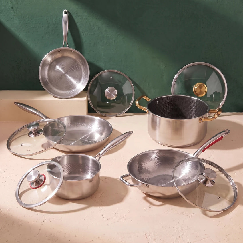 All 10 included pieces: two Titan frying pans, stockpot, sauté pan, saucepan and five matching lids
