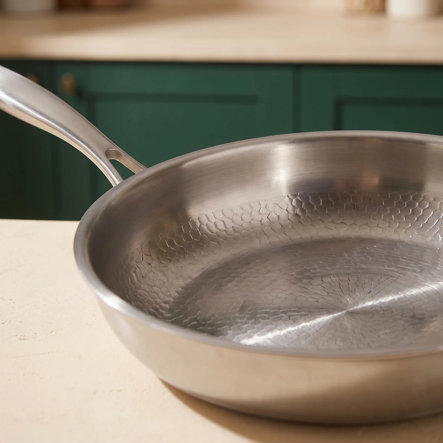 Close detail of the Titan pan’s hand-hammered titanium surface