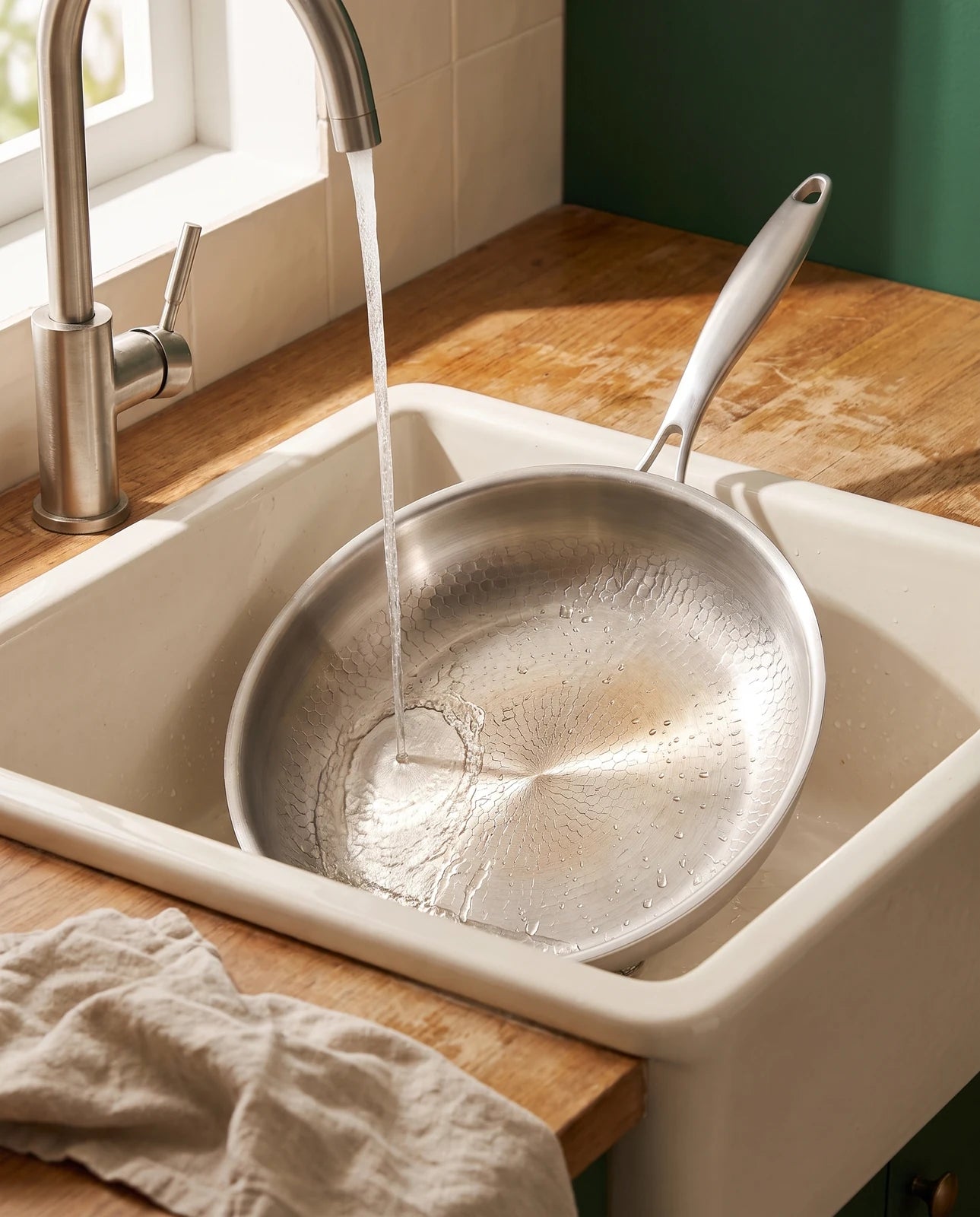 The pan being rinsed after cooking