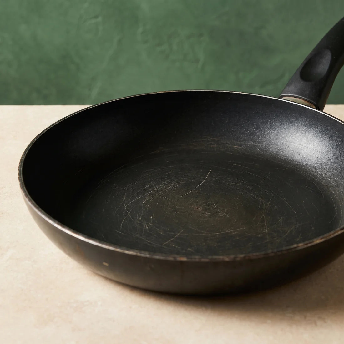Worn coating inside an old frying pan